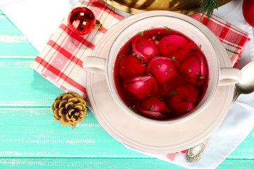 Traditional polish clear red borscht with dumplings