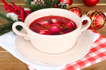 Obraz na płótnie Canvas Traditional polish clear red borscht with dumplings and
