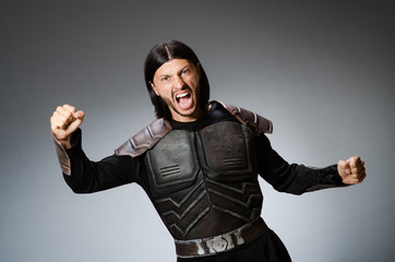 Angry warrior against dark background