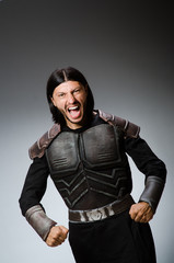 Angry warrior against dark background