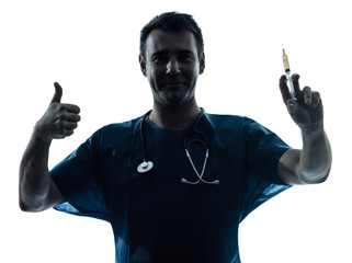 doctor man holding hypodermic syringe silhouette portrait