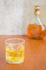 Glass of whiskey with ice