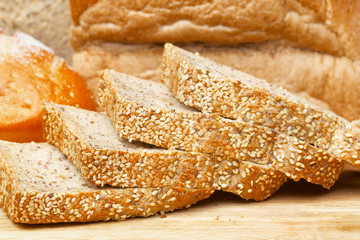 Rye bread slices on wooden table
