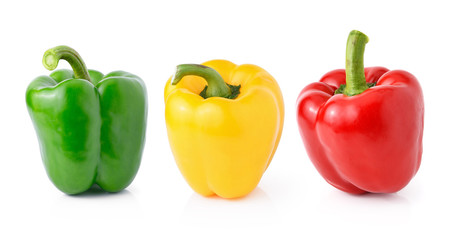 green yellow red pepper on white background