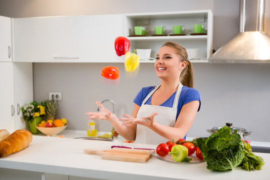 Young Woman  Juggle With Vegetables