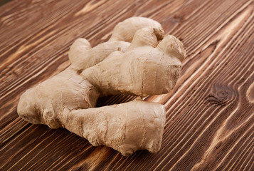 Ginger root sliced on wooden table