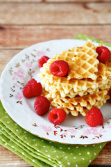 stack of waffles with raspberries