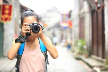 Foto op Canvas young woman photographer taking photo,yangshuo,china © lzf
