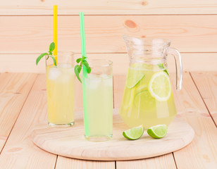 Glass pitcher full of lemonade.