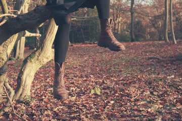 Legs of person dangling from tree