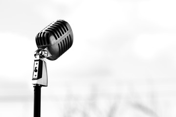 Silver vintage microphone in the studio on white background