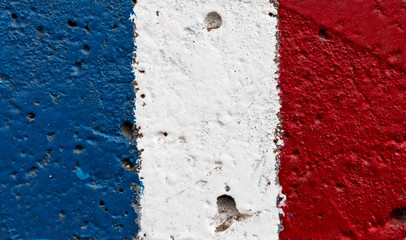 Flag of  France on  concrete wall