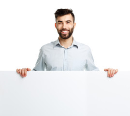 A young bearded man showing blank signboard, isolated over white
