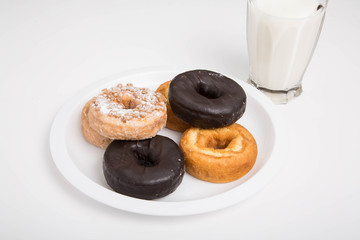 Variety of Donuts on White Plate