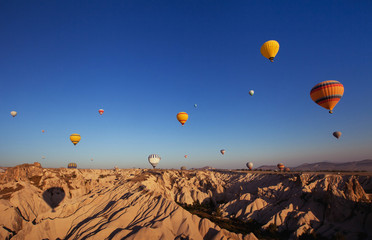 beautiful landscape with hot air balloons and mountains