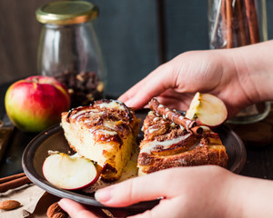 Christmas pie with spiced apples hold in hands