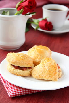 Home made scones with strawberry jam and a cup of tea