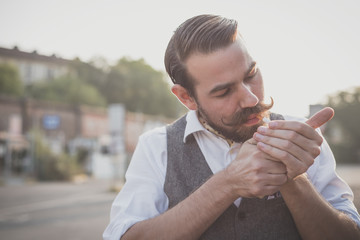 handsome big moustache hipster man smoking cigarette