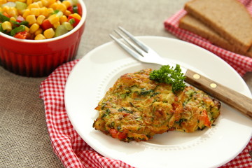 Homemade zucchini fritters with chorizo sausage and corn salsa