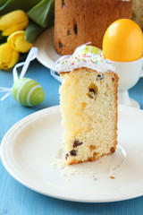 Slice of easter bread with colorful eggs and yellow