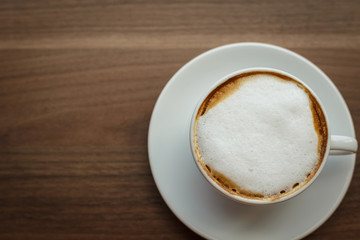 Coffee cup and book on the table