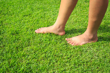 Foot step on green grass