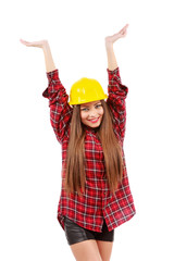 young woman worker in red shirt and yellow helmet with raised ha