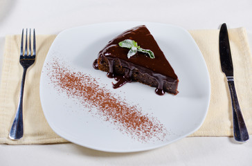 Freshly baked chocolate tart with sauce