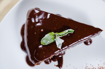 Freshly baked chocolate tart with sauce