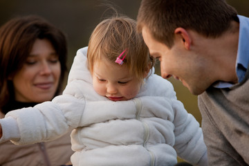 Mother Father and their little daughter