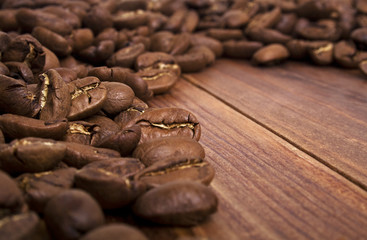 Coffee beans on wood background
