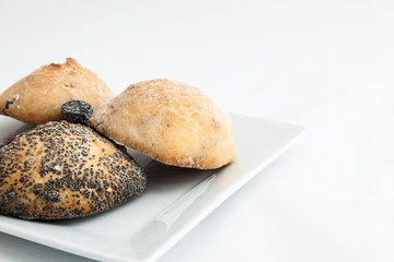 Composition of several breads isolated on white background