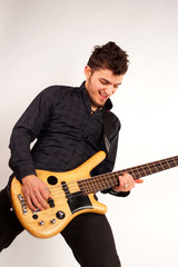 Obraz premium Bass player looking at his instrument