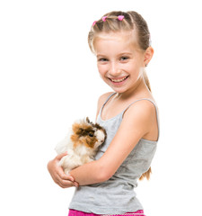 Little girl holding a guinea pig