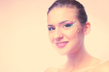 Portrait of beautiful woman with colorful make-up