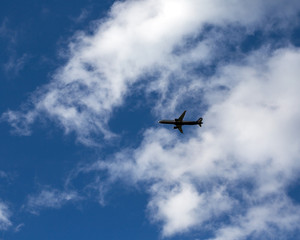 Fototapeta na wymiar Silhouette of airplane in the sky