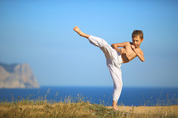 boy karate on the coast - 74028719