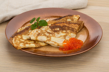 Pancakes with red caviar