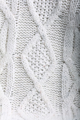texture of white wool knit sweater homemade