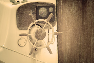 Obraz premium old wooden boat wheel