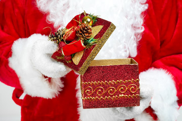 Hands of Santa Claus with gift