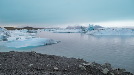 Lagoon of ice located in Iceland. Sunset.