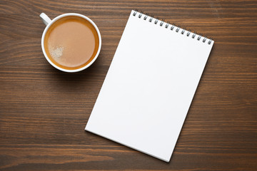 Obraz na płótnie Canvas cup of espresso and note pad, concept photo