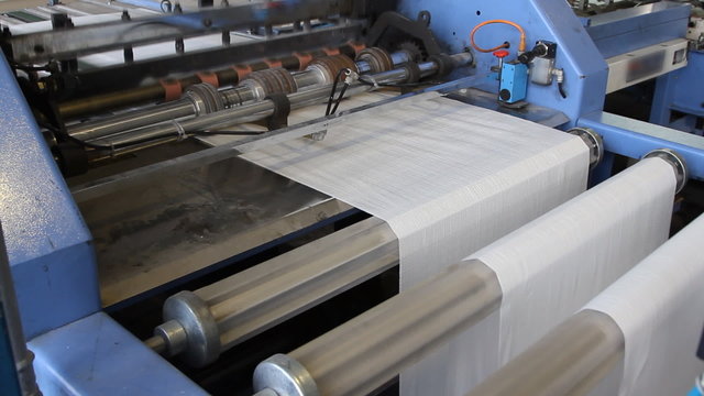 Big polymeric tape roll unreel for a printing press