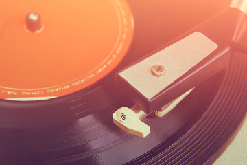 close up image of old record player, image is retro filtered . s