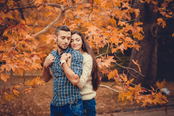 Young couple in autumn park