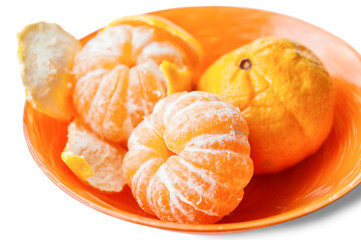 Ripe mandarins in orange plate