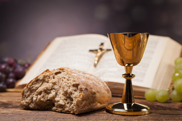 Obraz premium Sacred objects, bible, bread and wine.