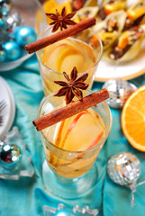 apple and orange drink with spices for christmas