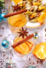 apple and orange drink with spices for christmas